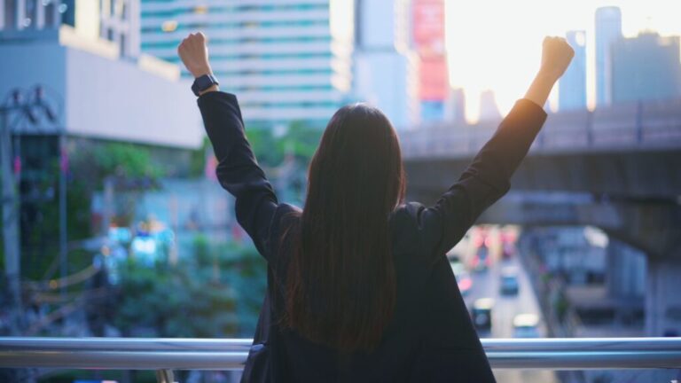 Back view of successful business woman over city view